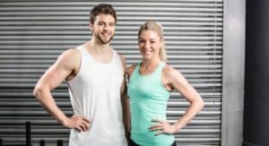 Fit couple smiling together promoting CoolSculpting Elite